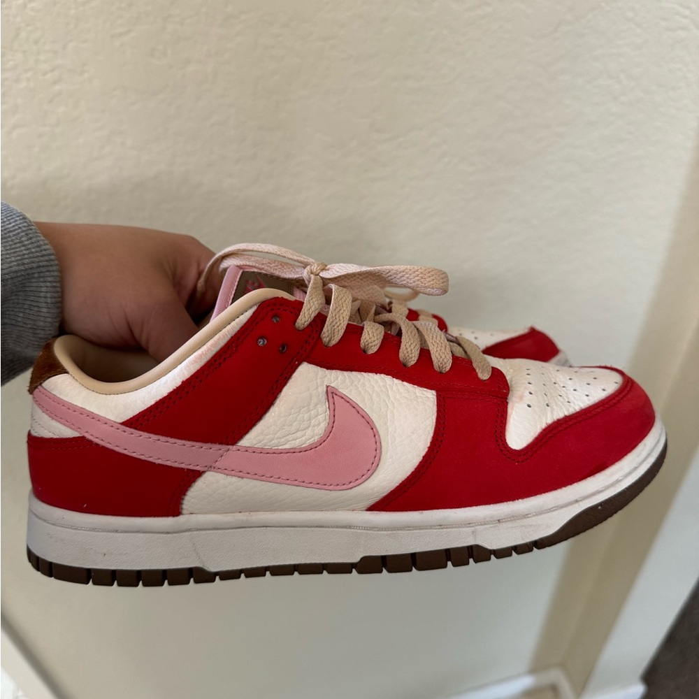 Woman’s Nike low dunk bacon size 8